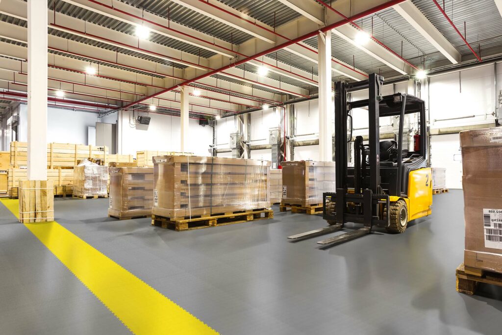 Large modern warehouse with forklifts